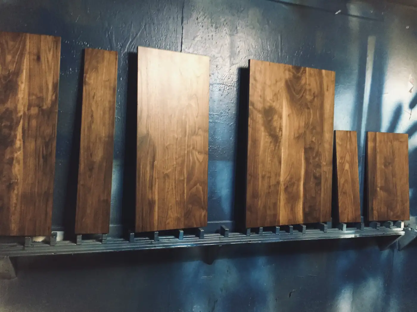 Walnut slabs racked in the Boulder shop