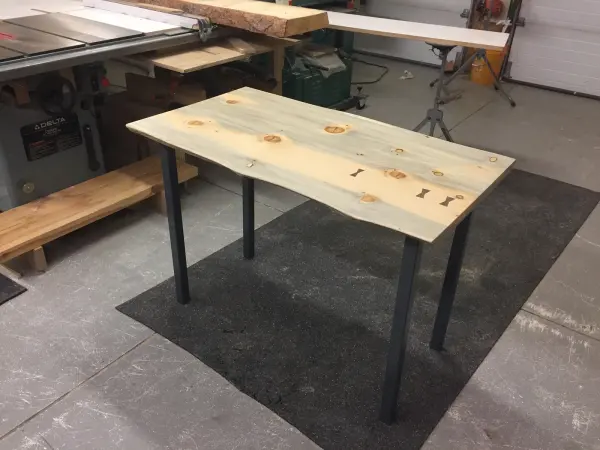 Live edge table with blackened steel legs