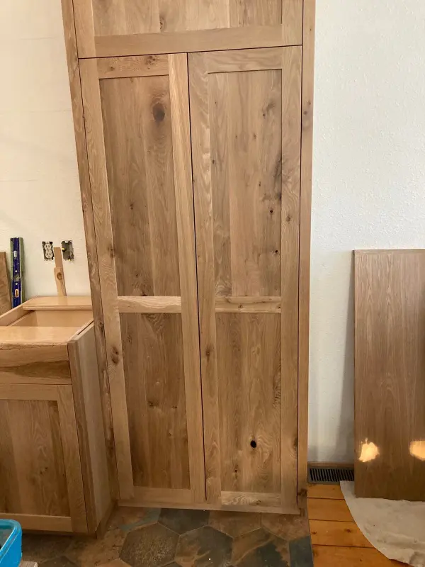 White oak custom cabinets during installation